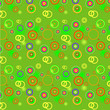 Bright green background with color spots, circles and rings