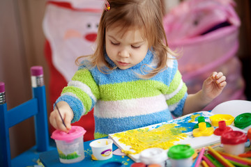 Little girl painting