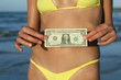 © Photo_Ma - Girl showing one dollar