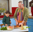 father and child cooking
