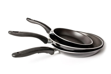 three fry pan on a white background