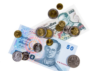 Wall Mural - Thai currency cash. Banknotes and coins on white background