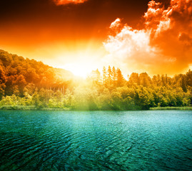 Poster - green water lake and sunset