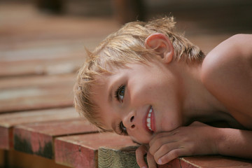 Wall Mural - boy on wood planks