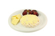 chesse, grapes and a rice cake on a white plate