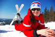 Happy young mountain skier resting on the slope