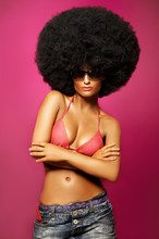 Beautiful Woman With Huge Afro Haircut On Pink