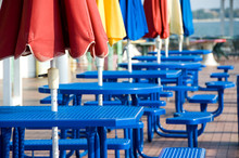 Blue Tables With Colorful Umbrellas