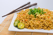 Asian noodle dish (Pancit) with Philippine lime on the side