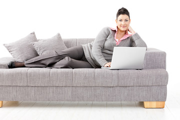 Canvas Print - Woman working on sofa