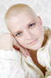 © elenarostunova - closeup portrait of young smiling bald bold woman