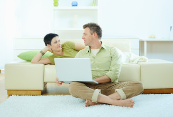 Wall Mural - Couple using computer at home