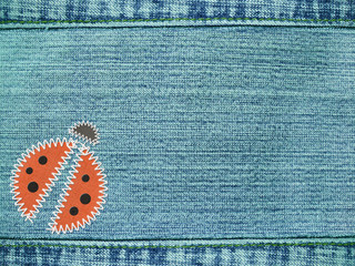 Sticker - Jeans background with ladybug