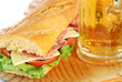 baguette sandwich closeup with beer