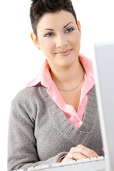 Wall Mural - Happy businesswoman using computer