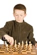 Young boy playing chess