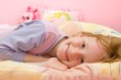 Smiling girl on bed