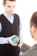 © Andreea Ardelean - Successful business maen with globe over a white background