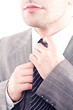 © Andreea Ardelean - Businessman wearing tie with white background