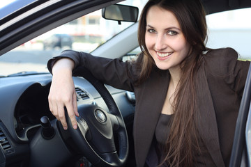 a young woman with her car