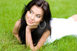 © ardni - Beautiful young brunette girl on a lawn