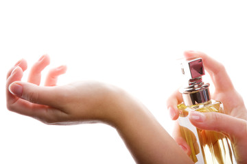 Close-up of a woman spraying her wrist