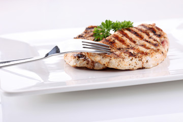 Sticker - Grilled chicken breasts on a plate with fresh vegetables