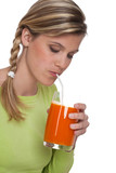 Fototapeta Młodzieżowe - Healthy lifestyle series - Woman drinking carrot juice