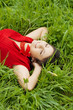 © Miramiska - Beautiful girl lying on the grass