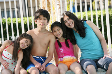 Wall Mural - Four children by the pool side