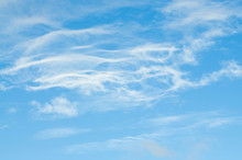 Wispy Cloud Group On Blue Sky