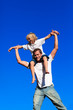 © WavebreakMediaMicro - Father giving his son a piggyback ride