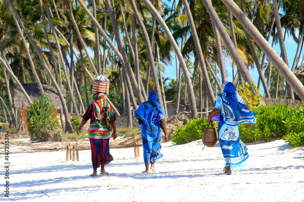 Zanzibar wimen on sandy beach - obrazy, fototapety, plakaty 