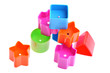 Various coloured blocks for shape sorter toy isolated on white