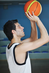 Wall Mural - basket ball game player at sport hall