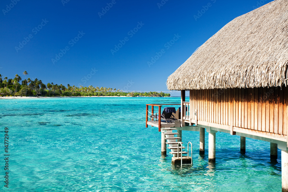 Over water bungalow with steps into lagoon - obrazy, fototapety, plakaty 