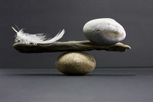 Feather And Stone Balance