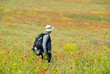 © Anton Gvozdikov - Happy hiker on a poppy field
