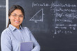 Teacher or Scholar  pose in front of blackboard