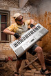 © Anton Gvozdikov - Musician plays a synthesizer