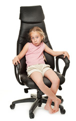 Wall Mural - Young girl sitting on chair. Isolated on white background