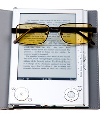 E-book with glasses isolated on white