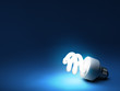 Compact fluorescent bulb - resting on blue background