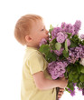 © Igor Stepovik - Portrait of adorable happy boy smelling bouquet of lilac