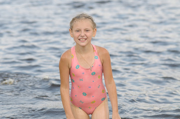 The girl in a pink bathing suit