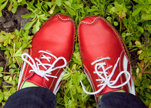 Red Running Shoes On A Grass