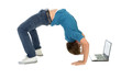 © pikselstock - Young man bending over backwards while using laptop