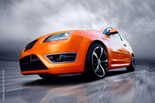 Cuadros en Lienzo Beautiful orange sport car on road