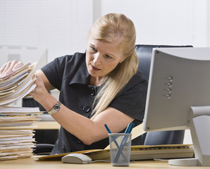 Woman Looking Through Paperwork