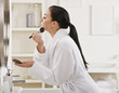 © AVAVA - Woman Putting on Makeup